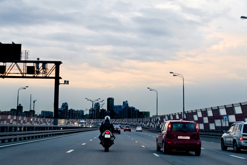Economists and travel experts say Labor Day, as usual, will see many Americans taking to the roads and the air.