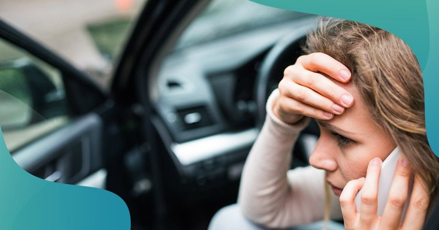 a young woman in distress after getting into a car accident