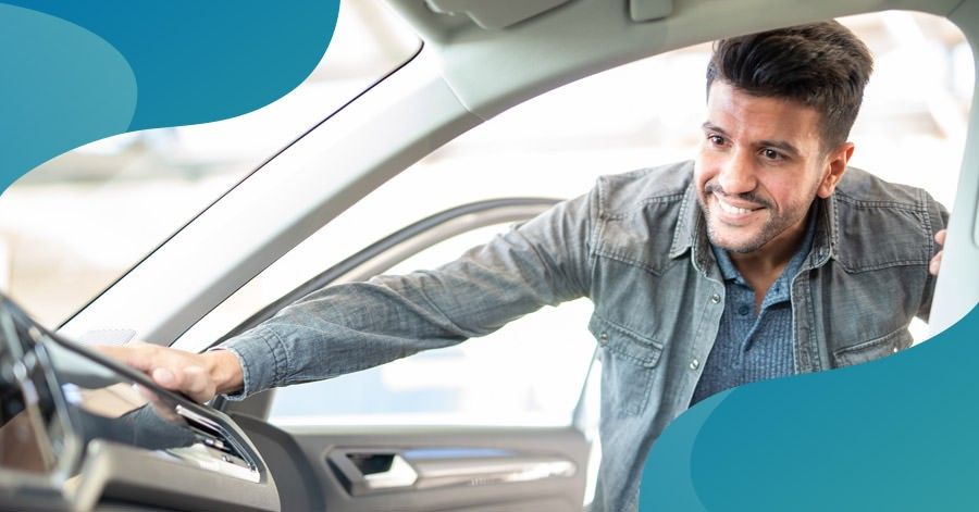 man looking at car for sale