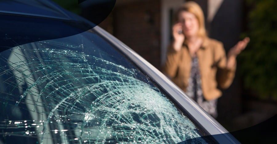 woman on phone after windshield cracks